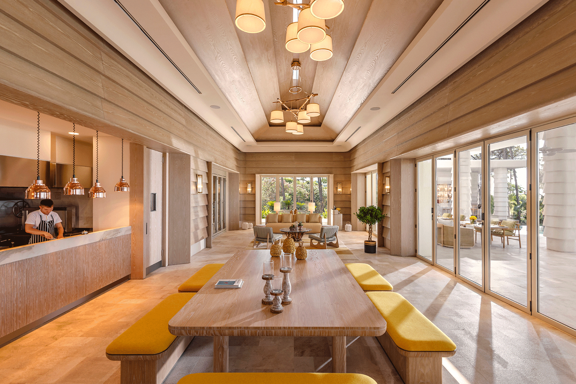 An artist 's impression of a dining room with a long table and benches.